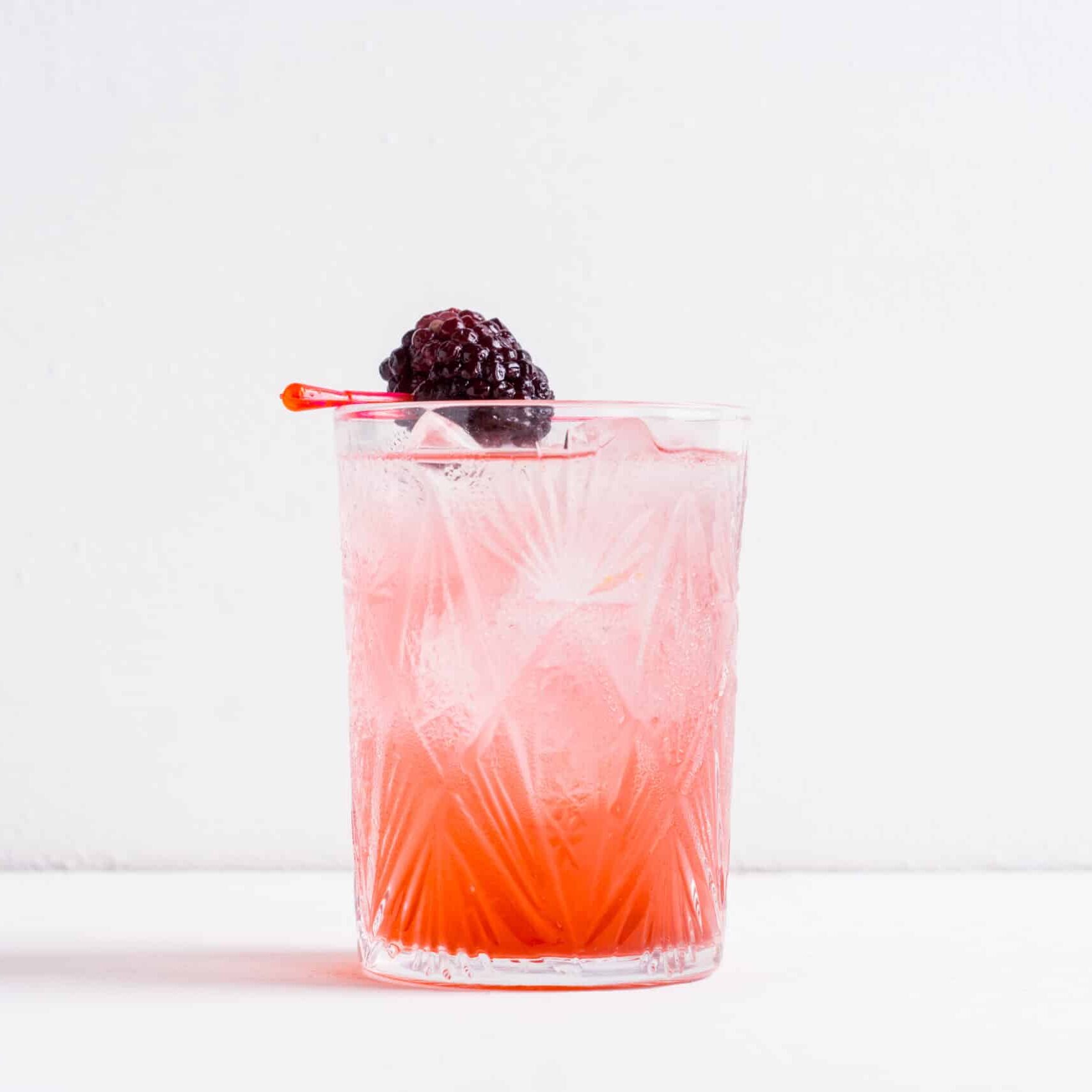 Blackberry cocktail on the wooden background